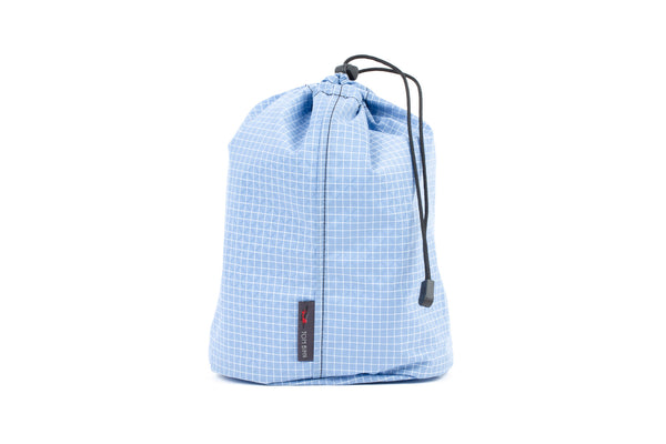 A Size 4 Tidal (light blue with white grid) 200 Halcyon Travel Stuff Sack.